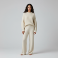 Front view of a cream knitted set with ribbed jumper and wide leg trousers