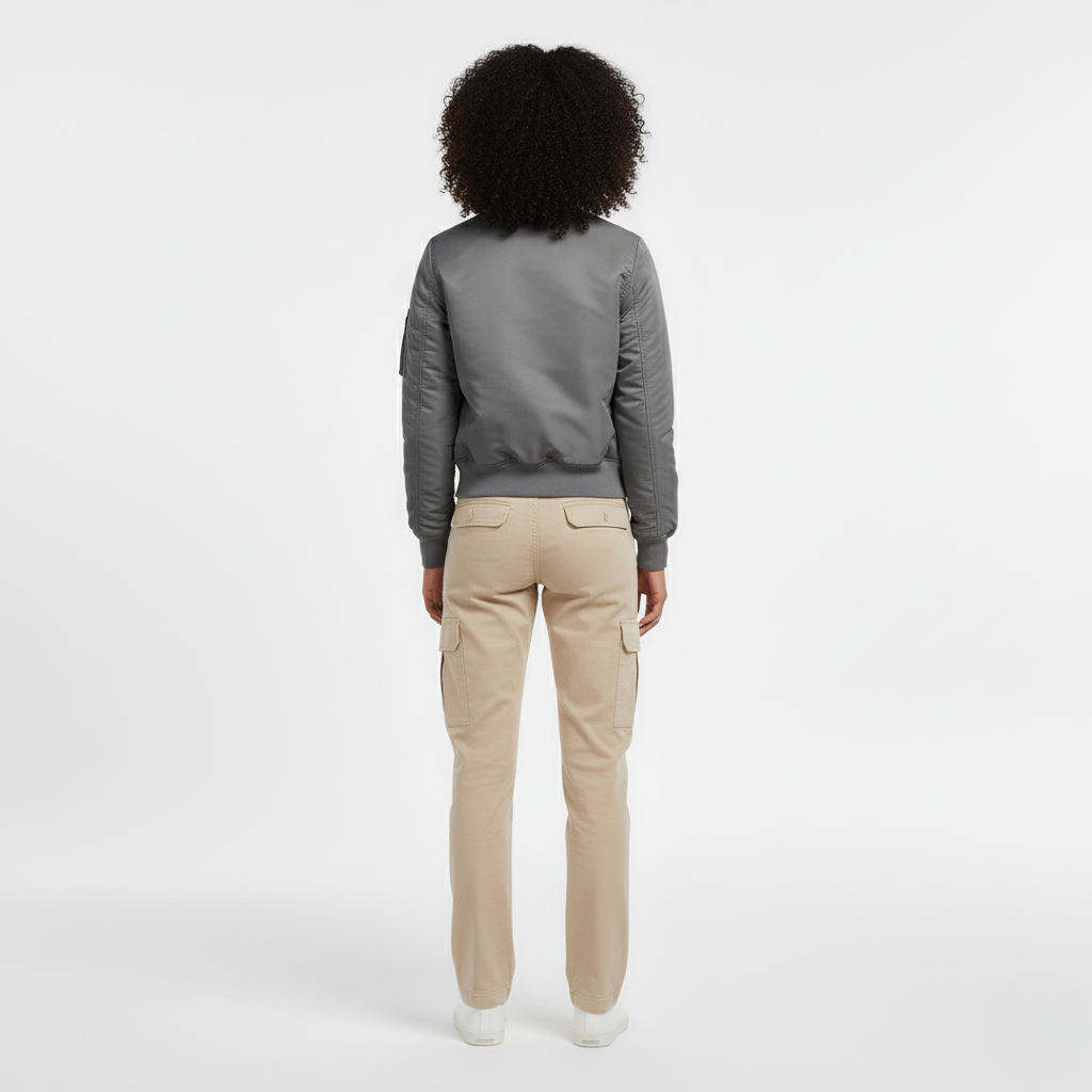 Grey bomber jacket with sleeve pocket seen from the back with beige cargo trousers